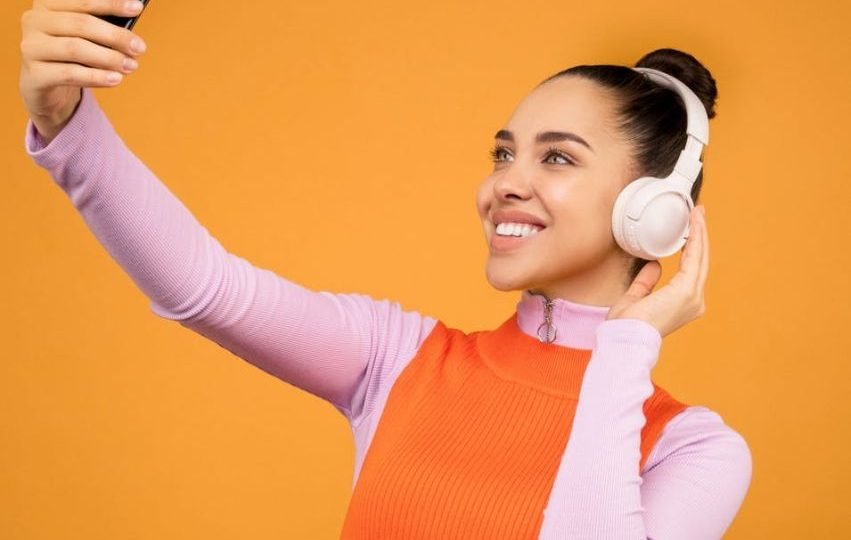 Women wearing a headphone things to do before going to a concert