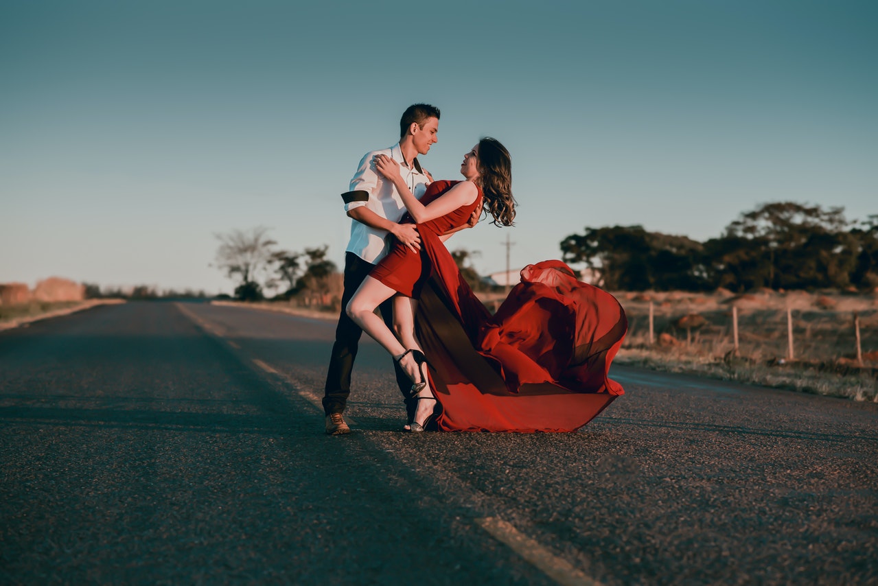 Elegant couple pose outdoors. Happy couple in a city center. Romantic photo  of a hugging couple. Young couple in love. Relationship concept - photo of  beautiful couple Stock Photo | Adobe Stock