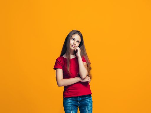 Young serious thoughtful teen girl. Doubt concept.